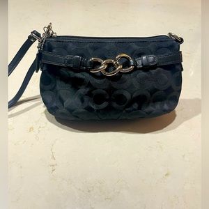 Black Coach wristlet in Classic C pattern